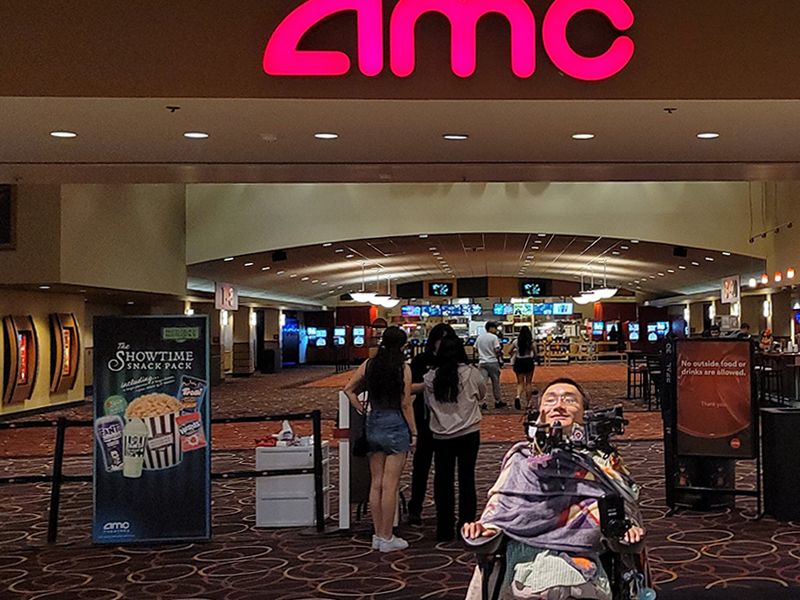 Paul in front of the AMC movie theater at the mall.